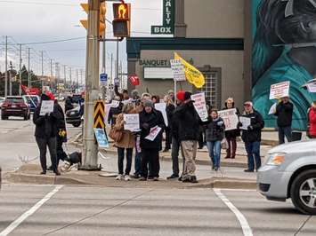 Protestors on Tecumseh Road East and Walker Road, Windsor, December 12, 2022. Photo by Mark Brown/WindsorNewsToday.ca.