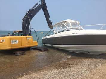 Boat being removed from shore Sat. July 4, 2015. Submitted photo. 