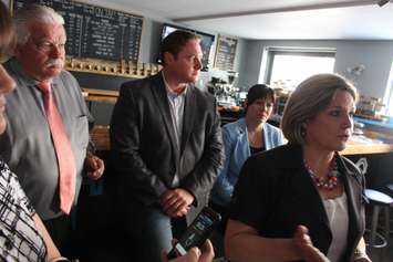 Ontario NDP Leader Andrea Horwath, right, Windsor-West MPP Lisa Gretzky, far right, Essex MPP Taras Nadyshak and Windsor-Tecumseh MPP Percy Hatfield speak at Craftheads Brewing Company, June 24, 2015. (Photo by Jason Viau)