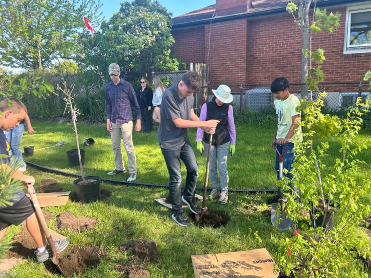 Grade 8 students at High Park Public School planting mini forests on May 8, 2028 (Photo by: Lindsay Newman/ Blackburn Media)