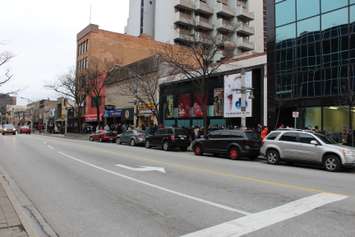 People in need line up along Ouellette Ave. in Windsor in hopes of receiving one of 500 turkeys being given away, December 17, 2014. (photo by Mike Vlasveld)