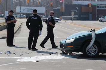One person has been sent to hospital following a crash at the intersection of Lauzon Rd. and McHugh St., April 1, 2015. (Photo by Jason Viau)