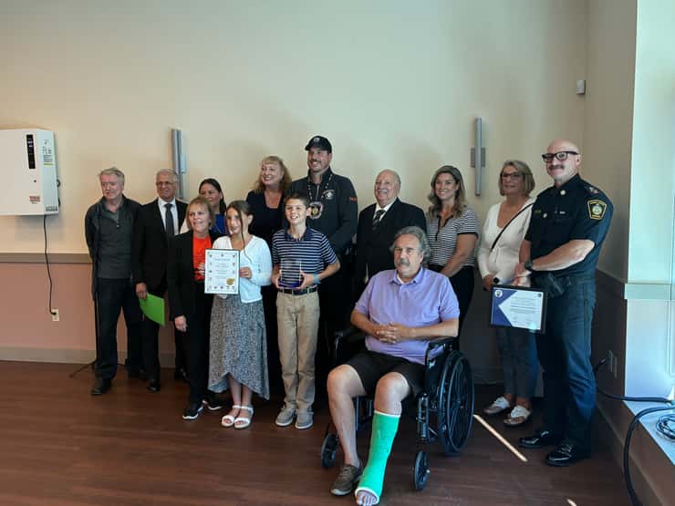 Cst. Tyler Callander with his family and local dignitaries. September 28, 2026. (Photo by Natalia Vega)