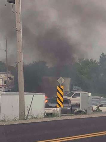A fire is seen in the area of Tilbury Auto Sales on August 18, 2018. Photo courtesy of Clare Tellier-Washburn/Facebook.