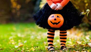 A little girl trick-or-treating on Halloween.  © Can Stock Photo / famveldman