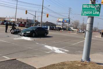 One person has been sent to hospital following a crash at the intersection of Lauzon Rd. and McHugh St., April 1, 2015. (Photo by Jason Viau)