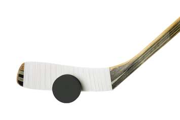 Hockey Stick and Puck. © Can Stock Photo / kozzi