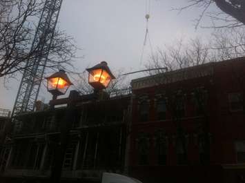 Workers unload a shipment of rebar at the downtown Chatham condo project site on January 23, 2015. (Photo by Mike James)