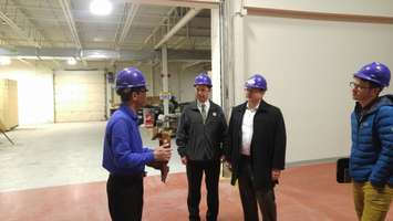 Green Party Sarnia-Lambton candidate Kevin Shaw (middle) and Green Party leader Mike Schreiner (right) speak with director Aung Oo (left) of the Sarnia-Lambton research park. March 21, 2018. (Photo by Colin Gowdy, Blackburn News)