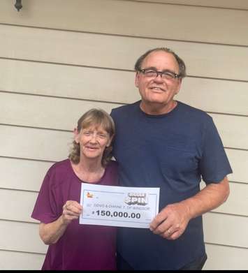 Denis and Dianne Trepanier of Windsor display their $150,000 cheque for winning on the OLGs The Bigger Spin. Photo submitted by Ontario Lottery and Gaming.