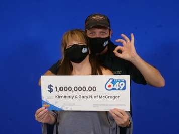 Kimberly and Gary Noel of McGregor show off their $1-million cheque at the OLG Prize Centre in Toronto, December 9, 2021. Photo courtesy OLG.