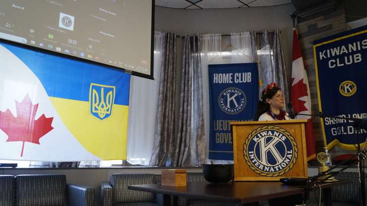 Olena Volodina discusses her family's story of coming from Ukraine to Canada during a Kiwanis Club of Sarnia-Lambton Golden K meeting. 18 July 2023. (Photo by Sarnia News Today)