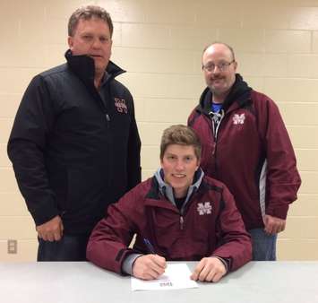 Dale Johnstone signs with Chatham Maroons.  (Photo courtesy of Maroons)