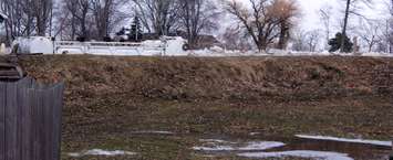 Ice can be seen peeking over the dike from the yards of properties on Poppe Road. February 8, 2019. (Photo by Greg Higgins)