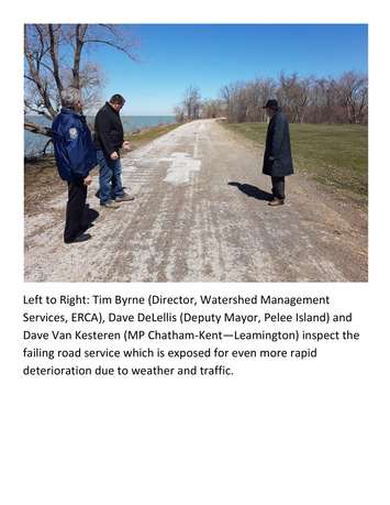 Tim Byrne of ERCA, left, Pelee Island deputy mayor Dave DeLellis and MP Dave Van Kesteren check out an eroding roadway on Pelee Island, April 20, 2018. Photo courtesy of Adam Roffel.
