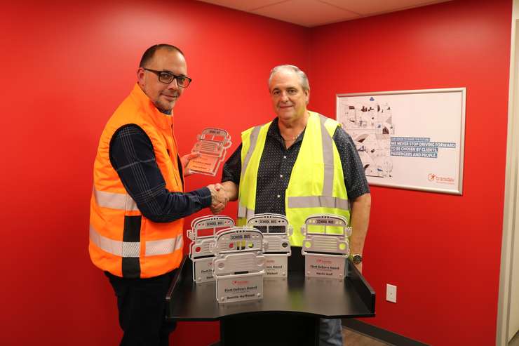 Olivier Tardif presenting award to Mike Huffman. Photo provided by Chuck Archer, Voyago Vice President of Marketing and Communications. 