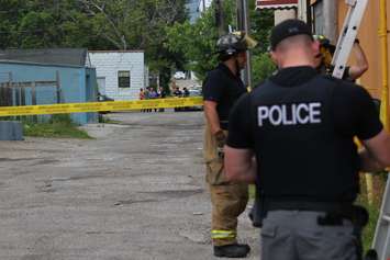 Police investigate an apparent homicide in the 500 block of Brant St., June 4, 2015. (Photo by Jason Viau)