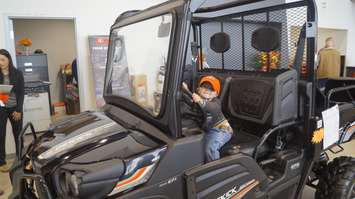 Hudson checking out a Kubota four wheeler at Southpoint Equipment in Wyoming. October 4, 2019. (BlackburnNews photo by Colin Gowdy)