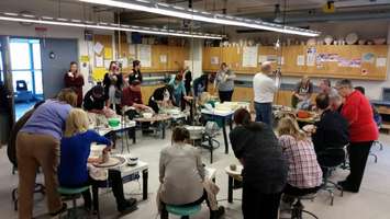 Local politicians, police and other community members work on pottery at Lambton College. January 12, 2015 (BlackburnNews.com photo by Jake Jeffrey)