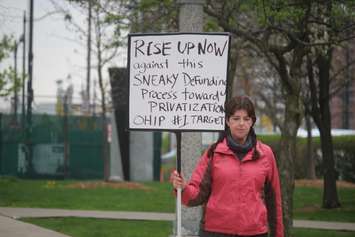 Protest sign at a rally at Charles Clark Square, Windsor, May 1, 2019. Photo by Mark Brown, Blackburn News.