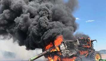 A combine fire. Image courtesy of Township of Warwick Fire and Rescue Department via. Facebook.