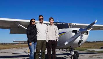 Kim and Doug Preiss with their son, Lincoln, who received his Recreational Pilot Permit on Monday, October 27, 2025. (Photo by Natalia Vega)