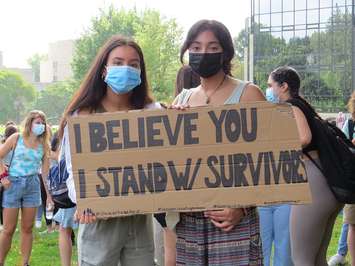 Western students holds signs during a walkout in support of survivors of sexual violence at Western University, September 17, 2021. (Photo by Miranda Chant, Blackburn News)