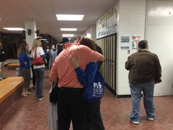 Save SCITS member Kara Woolridge embraces in a hug after hearing LKDSB's vote to close SCITS and consolidate students at SCSS. May 10, 2016 (BlackburnNews.com Photo by Briana Carnegie)