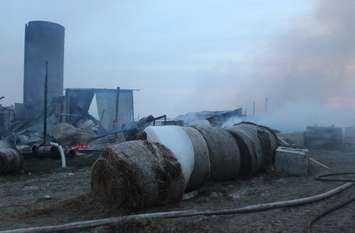Area fire departments battle blaze at dairy farm in Tecumseh, April 18, 2016. (Photo by Maureen Revait) 