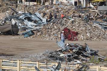 Crews demolish the GM smokestack, September 1, 2015. (Photo by Jason Viau)