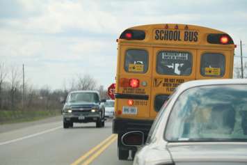 School bus stopped on road. BlackburnNews.com photo by Meghan Bond.