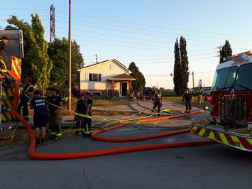Fire crews respond to a house fire at 565 Memorial Dr. in Windsor, July 9, 2018. (Photo by Mark Brown)