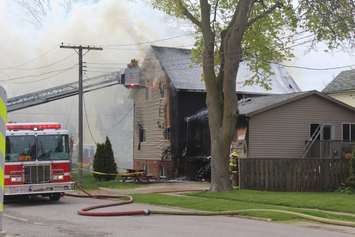 Firefighters battle a house fire in the area of Grant Street and Chatham Street in Chatham, May 8, 2019. (Photo by Allanah Wills) 
