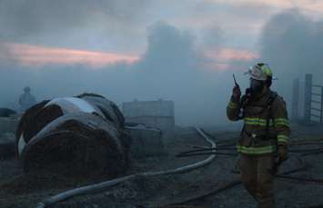 Area fire departments battle blaze at dairy farm in Tecumseh, April 18, 2016. (Photo by Maureen Revait) 