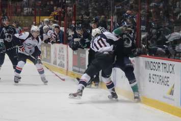Windsor Spitfires RW Markus Soberg lays out a Plymouth Whalers forward, December 31, 2014. (photo by Mike Vlasveld)
