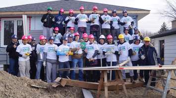 The Sarnia Sting helps with construction of Habitat for Humanity's latest build. December 2, 2014 (BlackburnNews.com photo by Jake Jeffrey)
