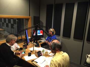 CHOK's Sue Storr on the 103.9FM/1070AM Anchor Desk with Analysts Larry Gordon and Mayor Mike Bradley. October 19, 2015 (BlackburnNews.com Photo by Briana Carnegie)