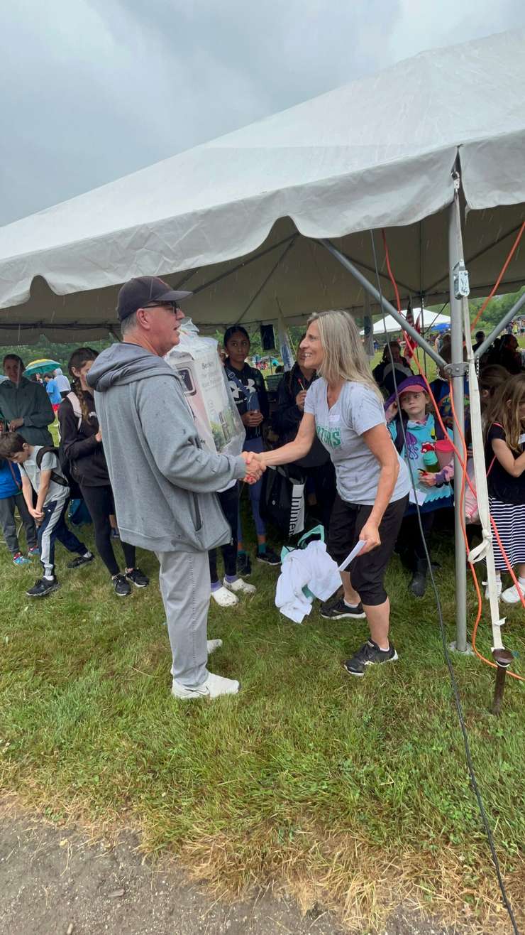 St. Anne Catholic School donating a water filtration system to Antler Elementary during a Pow Wow. 23 June 2023. (Photo by St. Clair Catholic School Board.