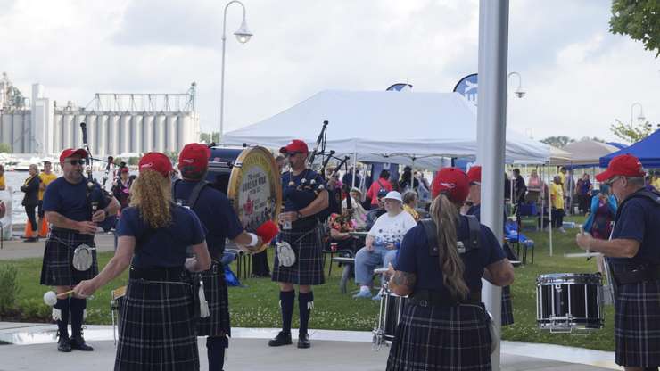 The Sarnia Legion Pipe Band performs during Sarnia's seniors cruise event. 26 June 2023. (Photo by Sarnia News Today)