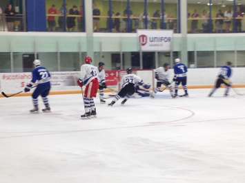 A flurry of action in front of Team O'Reilly goalie Greg Dodds. (Photo by Steve Sabourin)