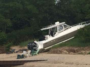 Police respond after a boat crashes into the shore near Canatara Park Beach, July 3, 2015. (Photo by Sue Storr)