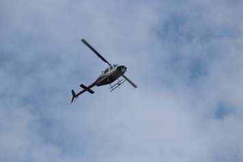 A helicopter surveys the area around the EC Row Expressway and Central Avenue in Windsor on August 25, 2016 after a tornado caused heavy damage in the area. (Photo by Ricardo Veneza)