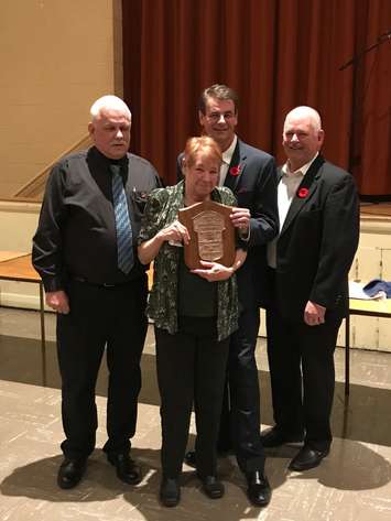 Linda Haskell (middle, front) receives the Mrs. Goodfellow 2019  award. Also pictured are (from left) Craig Williston, Tim Haskell, and Tim Mifflin. (Photo courtesy of Amanda Thibodeau)