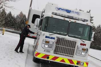 Windsor police detectives canvass the Benjamin Ave. area on January 21, 2015 where a pregnant woman was murdered on December 11, 2014. (Photo by Jason Viau)