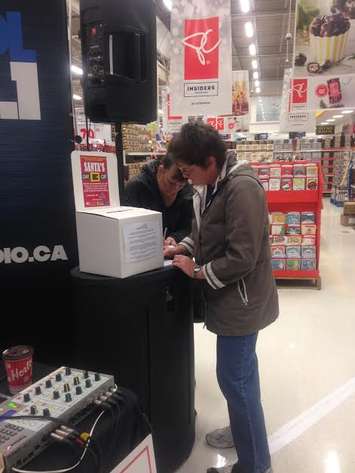 Blackburn Radio and McKinlay Funeral Homes band together to support the Chatham Goodfellows’ “No Child Without a Christmas” campaign at the Real Canadian Superstore, December 2, 2015. (Photo courtesy of 
Meagan Judd) 