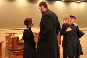 The sister of fallen veteran and Wheatley native John Gallagher, Erin Gallagher (left) is seen with other family members in mourning at the Blenheim Community Funeral Home on November 20, 2015. (Photo by Ricardo Veneza)