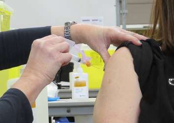 A public health nurse administers the COVID-19 vaccine. (File photo by Miranda Chant, Blackburn News)
