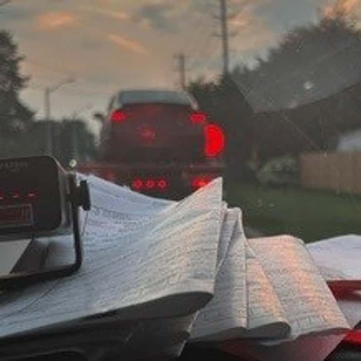 A towed vehicle and police paperwork are shown in Kingsville on August 14, 2026. Photo courtesy Ontario Provincial Police West Region/X.