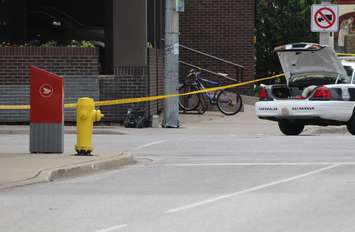 Windsor police investigate a suspicious package on the corner of Chatham St. and Goyeau St. downtown, June 17, 2015. (Photo by Mike Vlasveld)