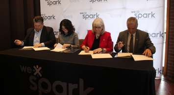 WRH CEO David Musyj, St. Clair College President Patti France, HDGH CEO Janice Kaffer and University of Windsor President Robert Gordon sign the memorandum of understanding for WE SPARK Health Institute, March 9, 2020. (Photo by Maureen Revait) 